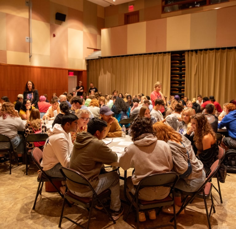 Photo of students within conference room