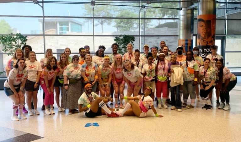 Large group of Muhammad Ali Center staff in Red Bicycle t-shirts