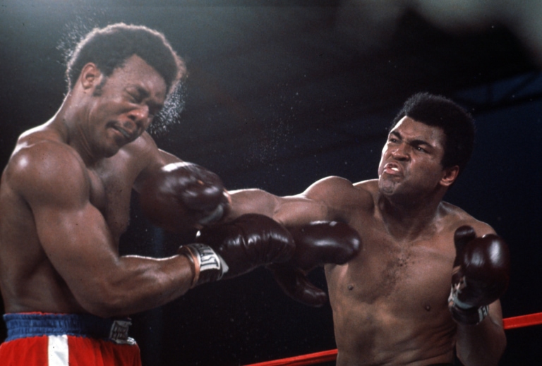 Action shot of Muhammad Ali punching George Foreman