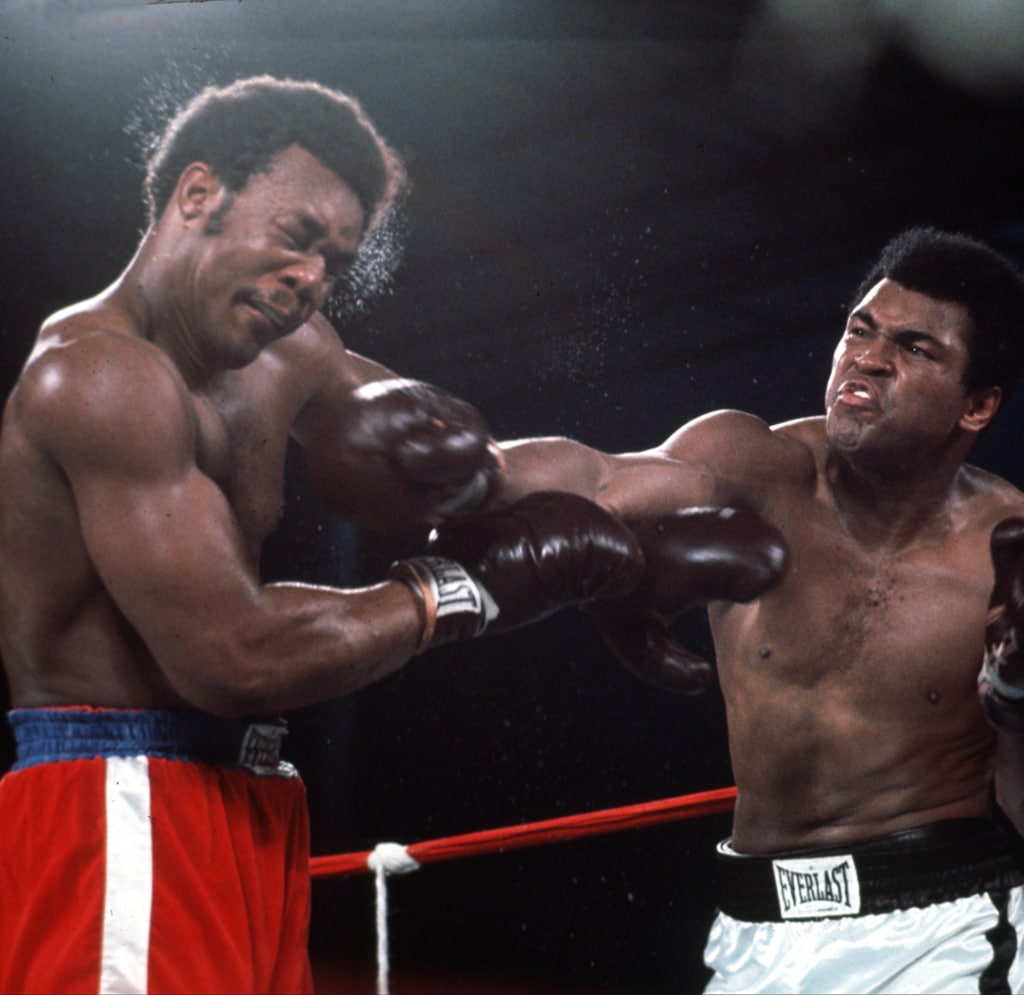 Action shot of Muhammad Ali punching George Foreman