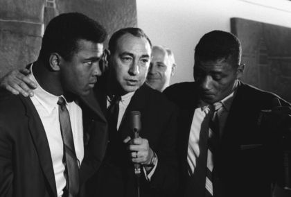 Muhammad Ali and Howard Cosell with a microphone