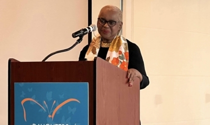 Woman standing behind a podium