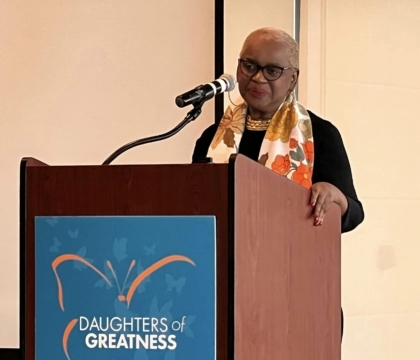 Woman standing behind a podium