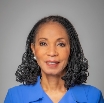 Portrait photo of a woman in blue business attire