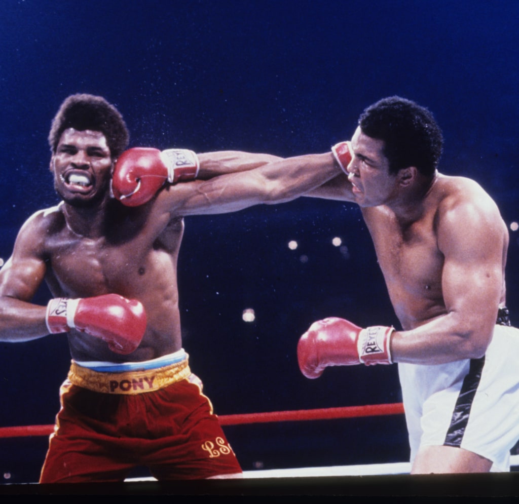 Action photo of Muhammad Ali trading punches with Leon Spinks