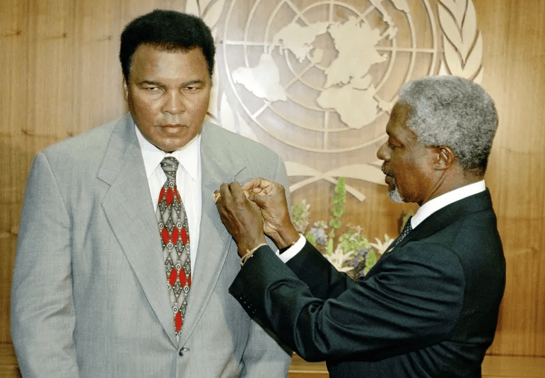 Photo of Muhammad Ali receiving UN Messenger of Peace pin from Secretary-General Kofi Annan